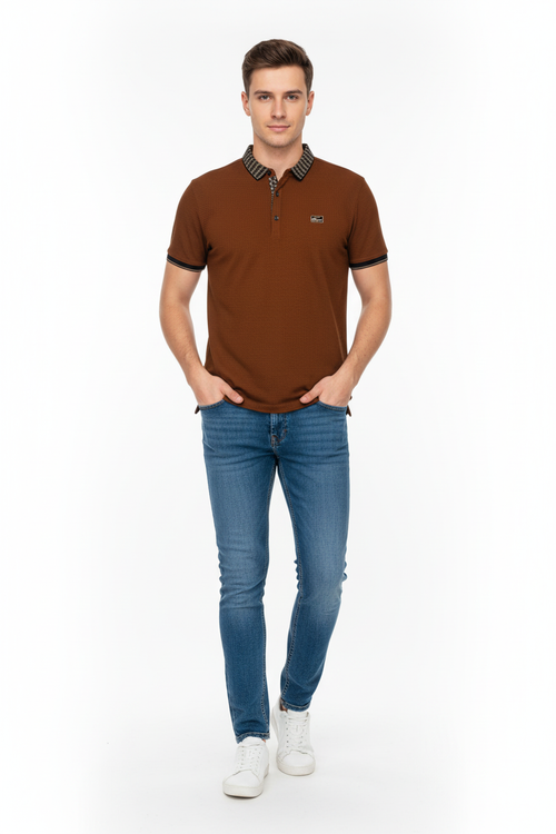 Young man wearing brown polo shirt and jeans