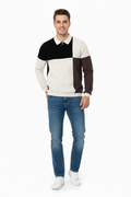 Young man wearing color-blocked polo sweatshirt and jeans
